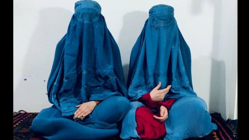 The two singers with burkas appear on a video