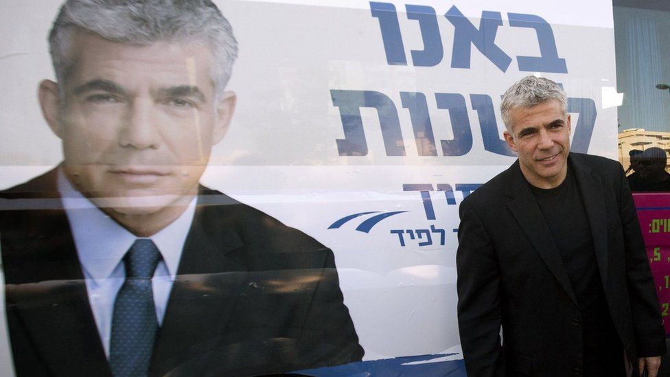 Yair Lapid, leader of the Yesh Atid party, visits a polling station in the Israeli coastal city of Netanya on 22 January 2013