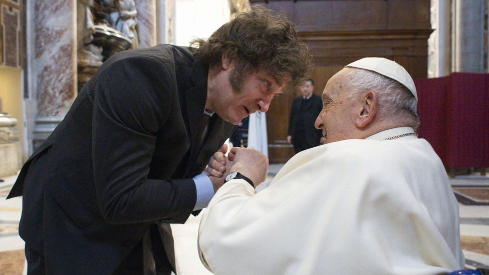 Javier Milei and the Pope holding hands and talking