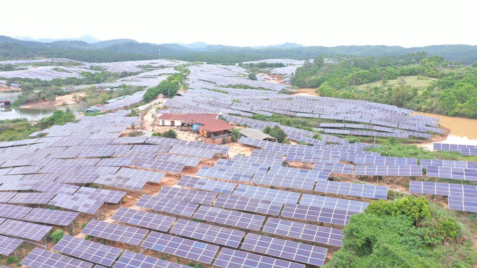 Rows of solar panels surrounding a house