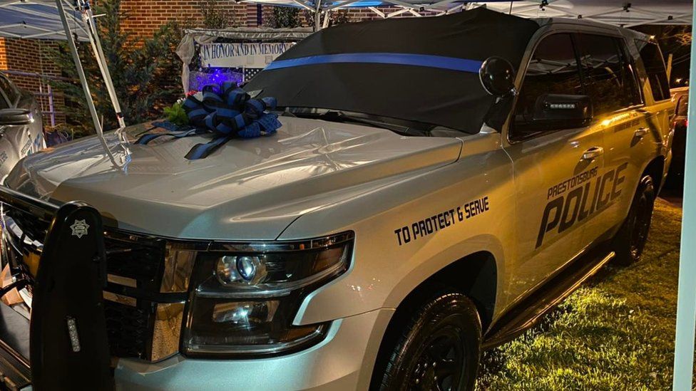 Police car with wreath