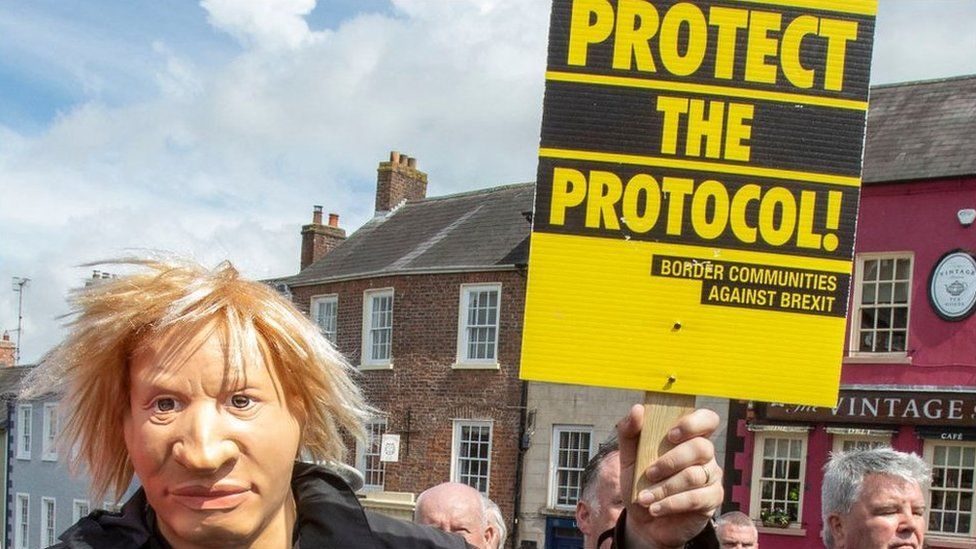 Protester in a mask supporting the protocol on 16 May 2022 in Hillsborough