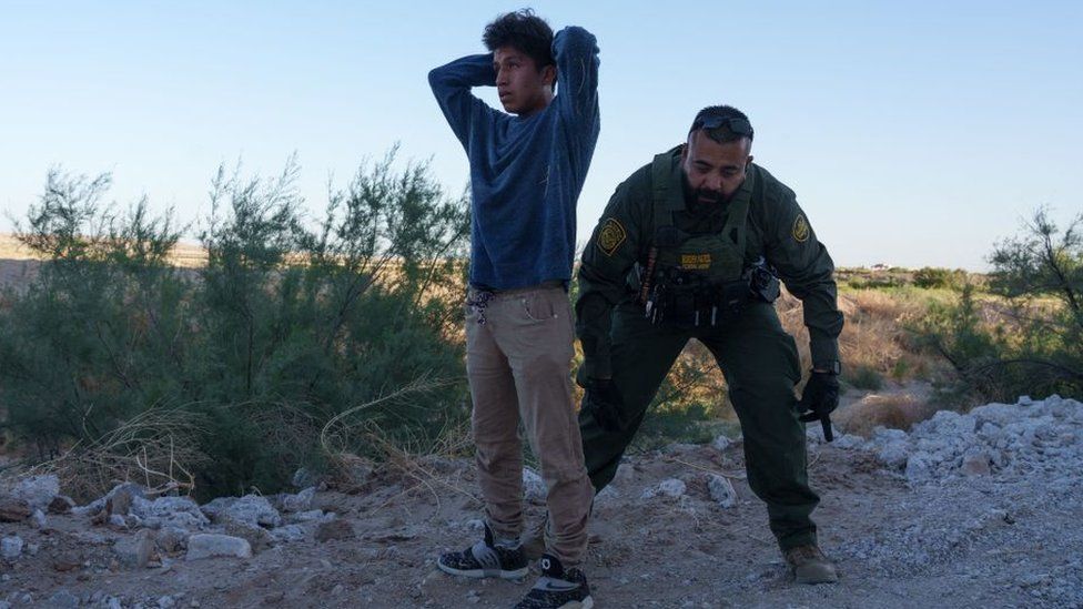 Migrant and Border Patrol officer
