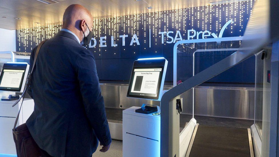 A passenger using Delta's new facial recognition system