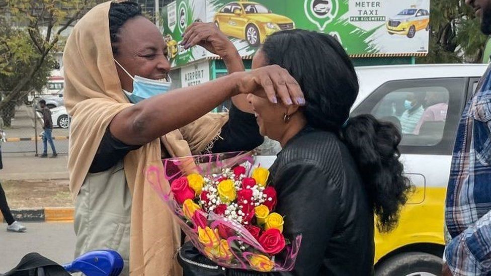Passengers arriving from Tigray are greeted by relatives at the Bole International Airport in Addis Ababa on December 28, 2022