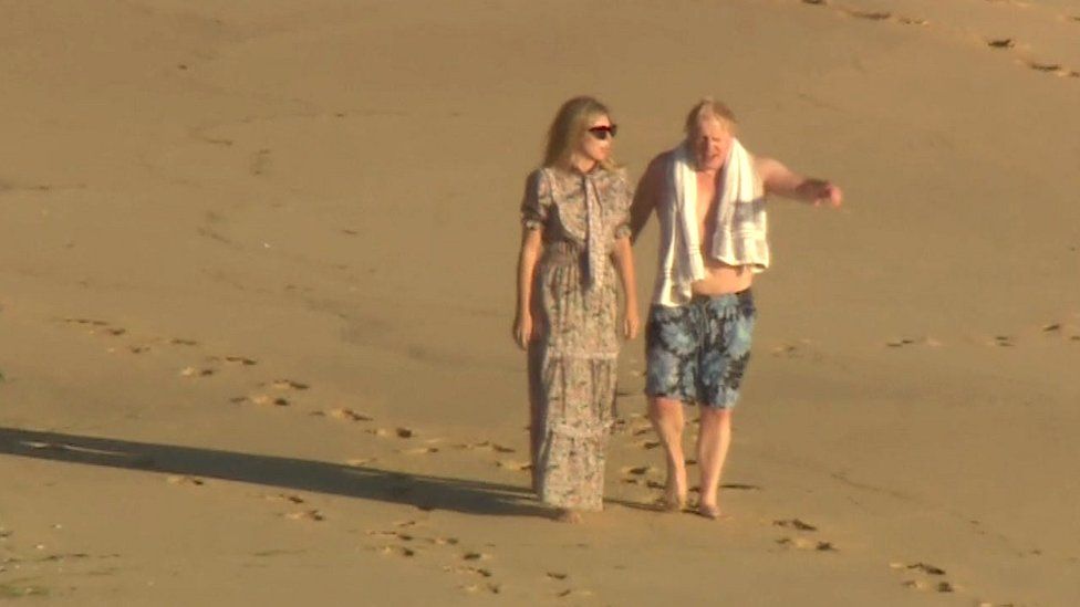 Boris and Carrie Johnson on beach at Carbis Bay