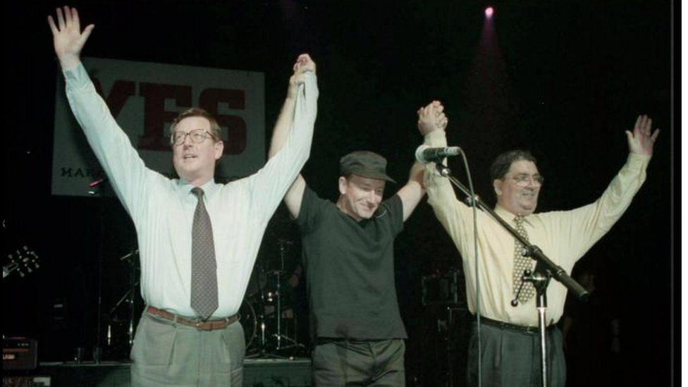 Bono on stage with John Hume and David Trimble