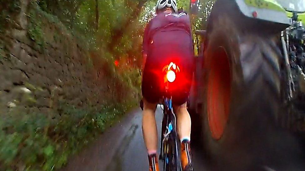 Cyclist and tractor