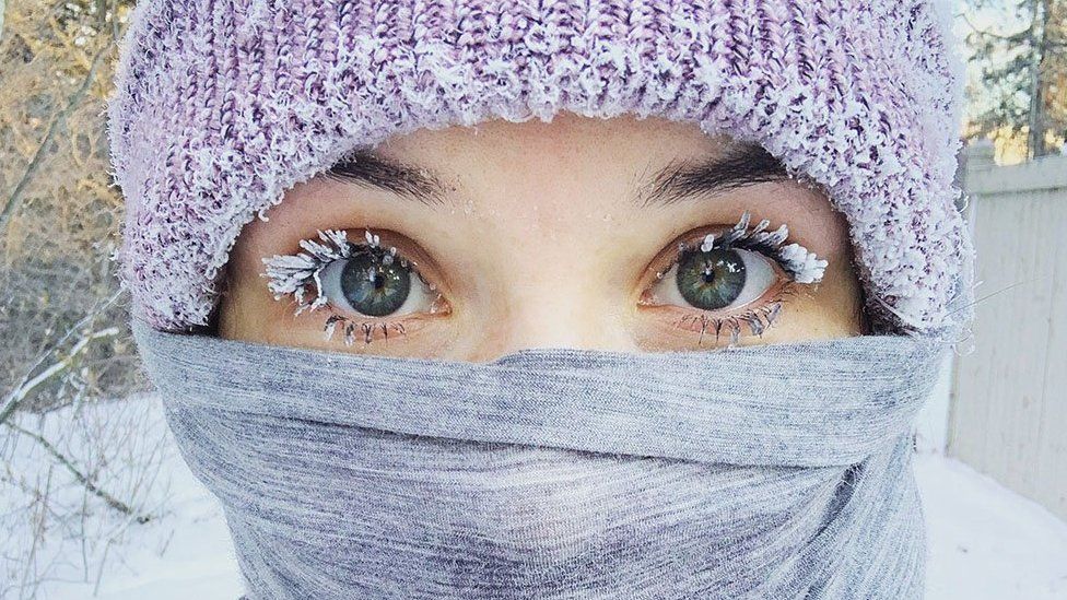 Woman with frozen eyelashes