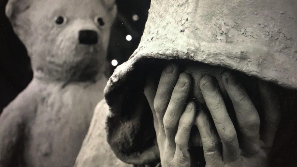 close up of the bear with me statue