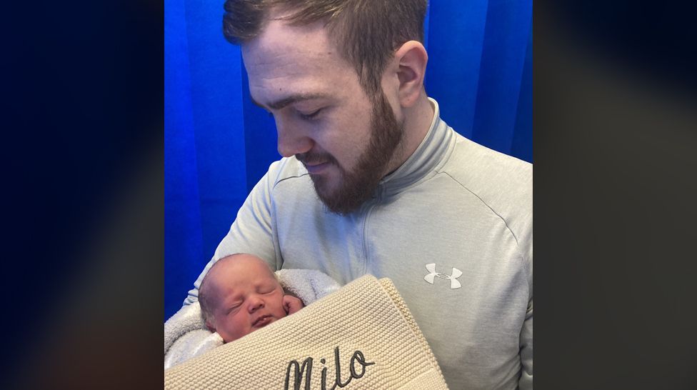 Baby Milo with his dad, David