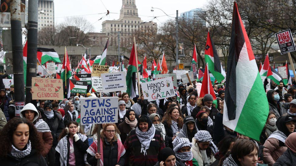 Pro-Palestinian demonstrators attend a rally in Toronto, Ontario on December 2, 2023.