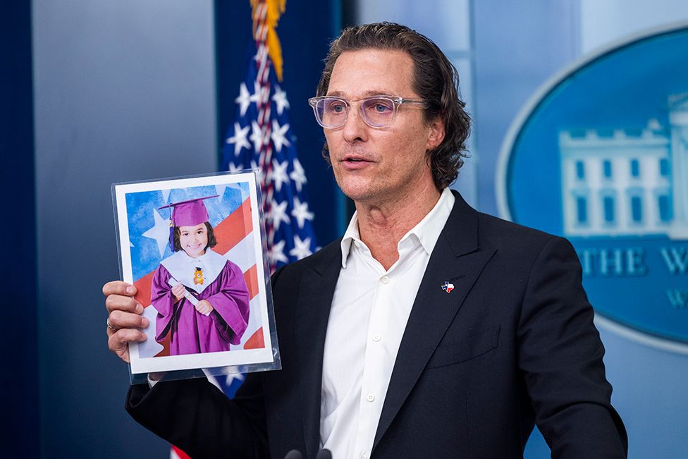 Actor Matthew McConaughey holds a picture of Uvalde shooting victim Alithia Ramirez as he calls for gun responsibility in the USA, on 7 June 2022