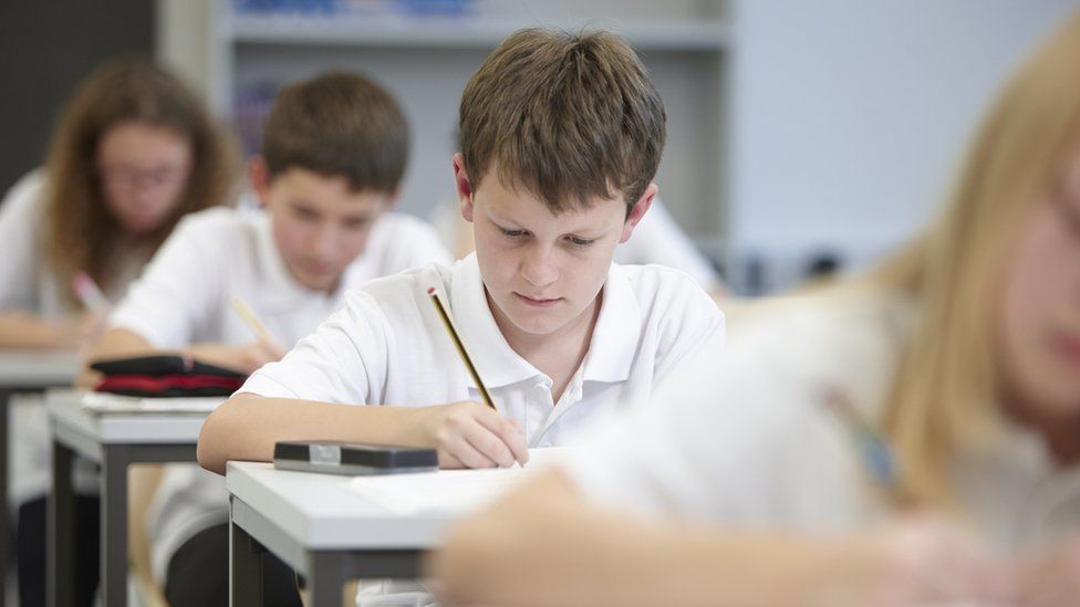 school pupil sitting exam