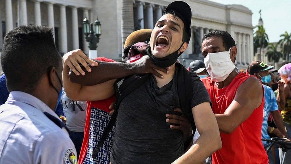 A man is arrested during a demonstration against the government of Cuban President Miguel Diaz-Canel in Havana