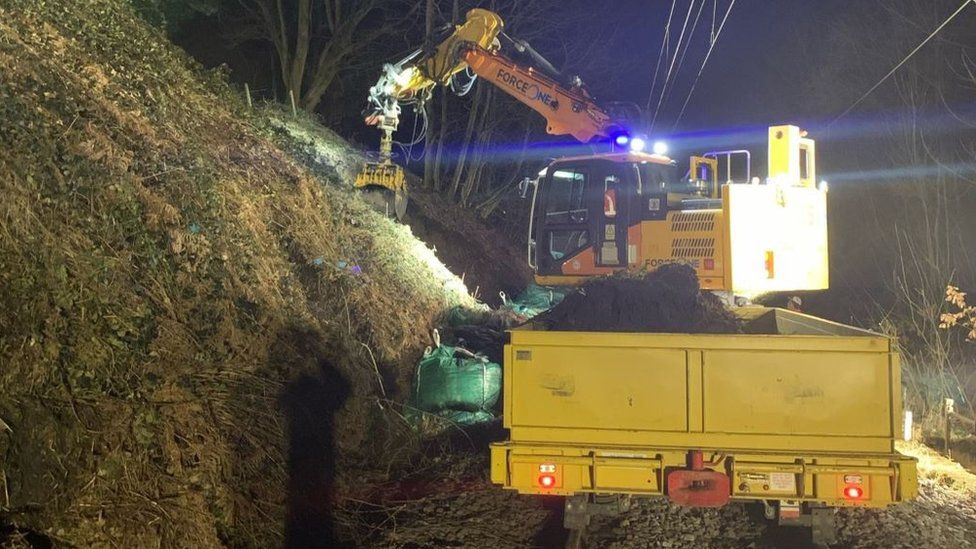 Engineers working to repair the landslip