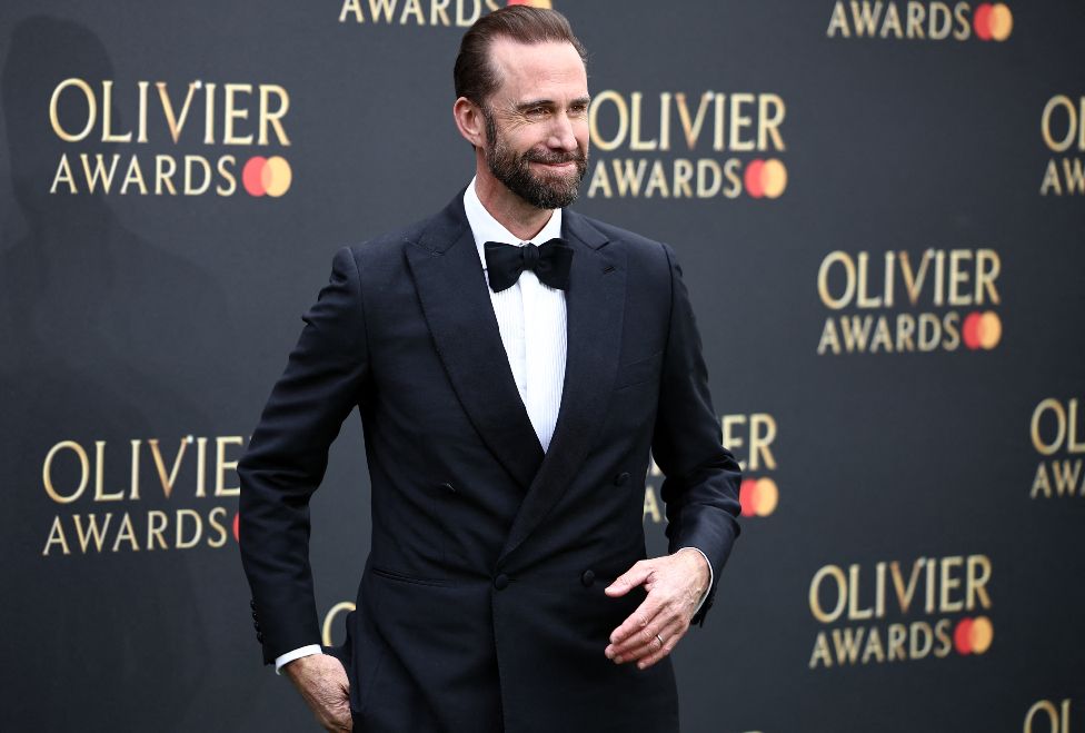 British actor Joseph Fiennes poses on the green carpet upon arrival to attend The Olivier Awards at the Royal Albert Hall in central London on April 14, 2024