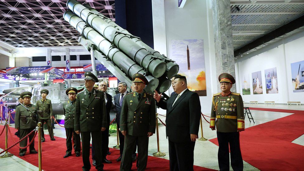 North Korean leader Kim Jong Un and Russia's Defense Minister Sergei Shoigu visit an exhibition of armed equipment on the occasion of the 70th anniversary of the Korean War armistice