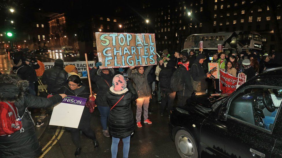 Campaigners outside Downing Street, London, protest against government plans to deport 50 people to Jamaica