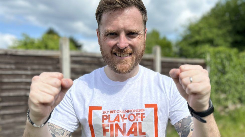 Alex Roberts from Luton wearing a Play-off final tshirt