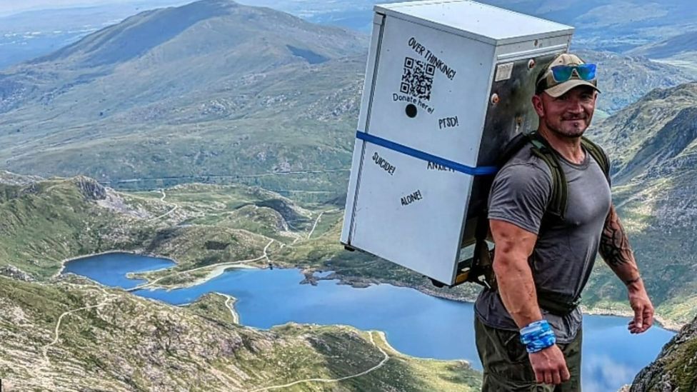 Michael Copeland carrying fridge