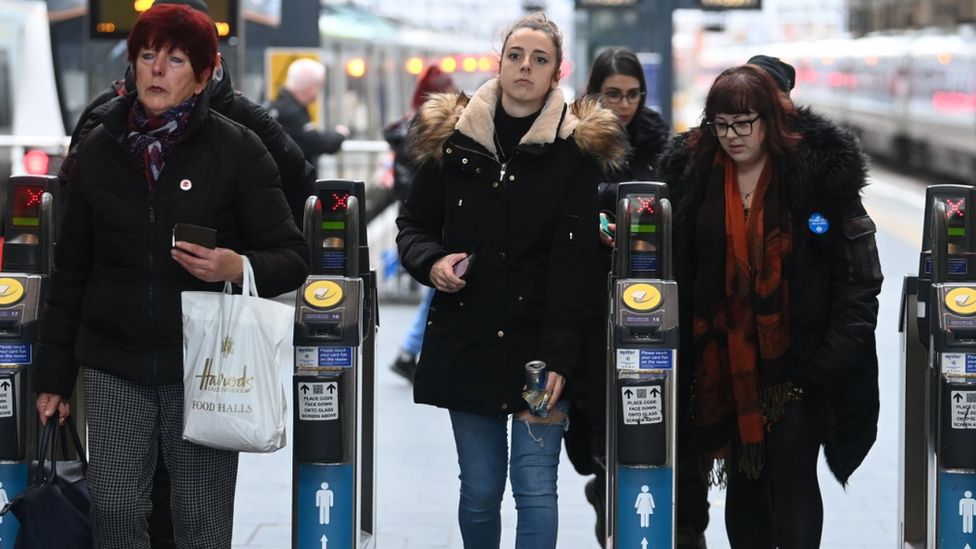 Passengers at King's Cross station in London