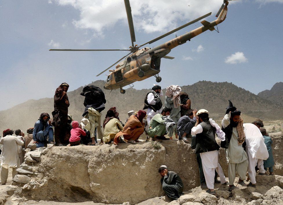A Taliban helicopter takes off after delivering aid to the site of an earthquake in Gayan, Afghanistan, June 23, 2022.
