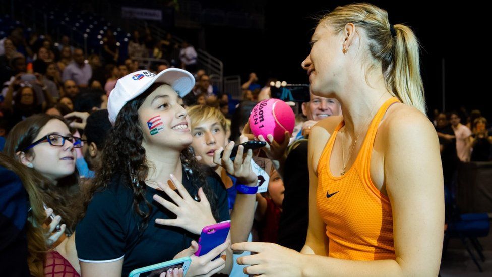 Maria Sharapova meets young fans after an exhibition match in Puerto Rico in December 2016