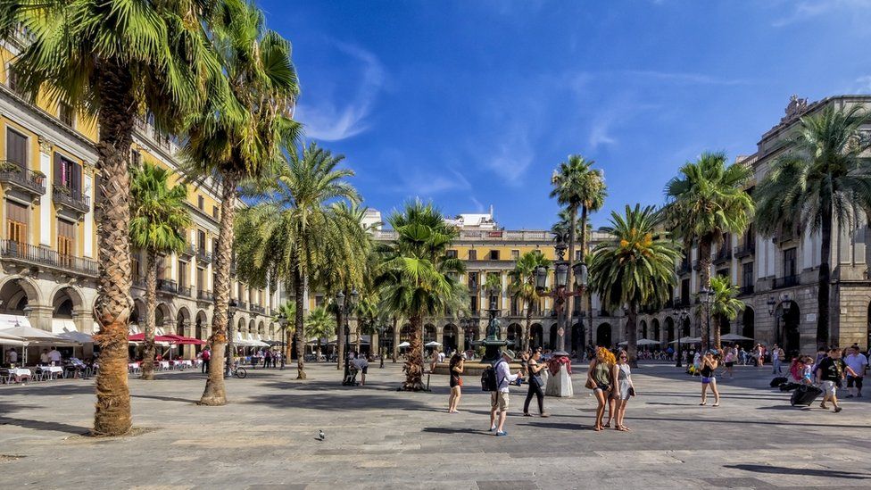 Tourists in Barcelona's Gothic quarter