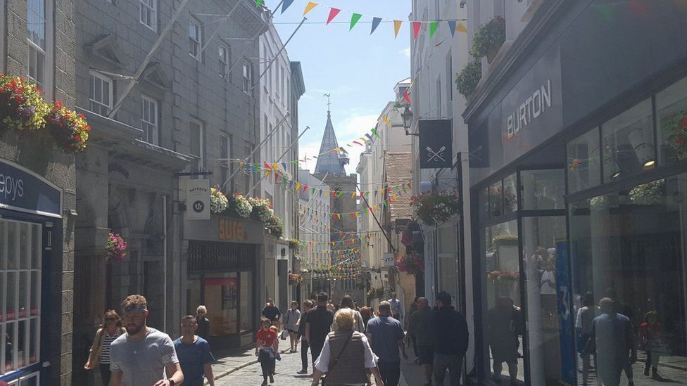 St Peter Port high street with people shopping