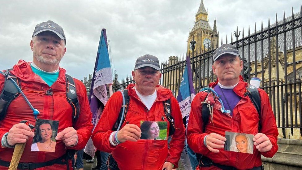 Mike Palmer, Andy Airey and Tim Owen standing outside Parliament in London after completing one of their charity walks