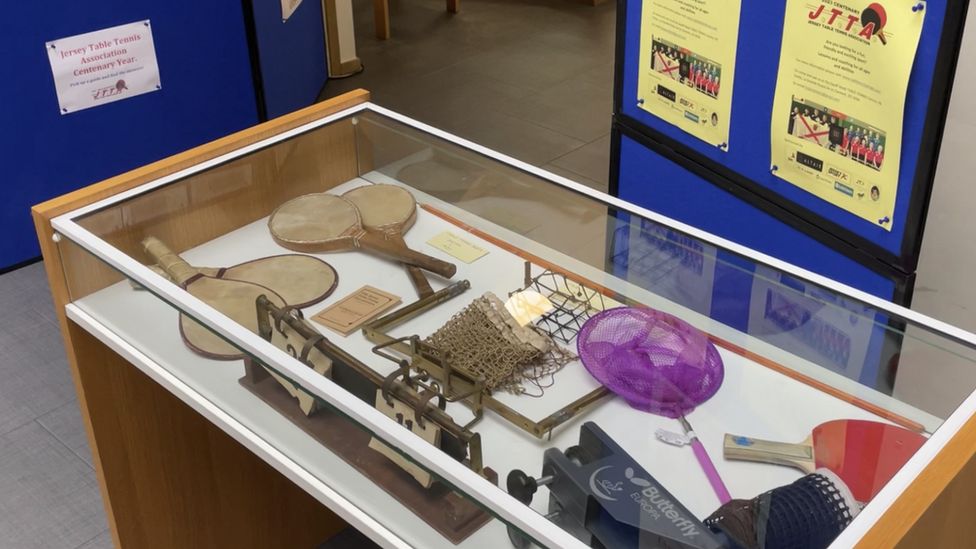 Table tennis equipment in a display case