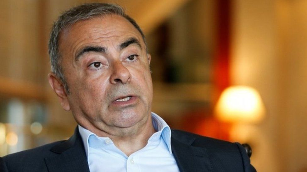 Fugitive former car executive Carlos Ghosn, gestures as he talks during an interview in Beirut.