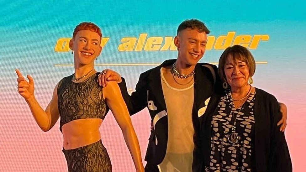 Photo of Olly Alexander, his mum Vicki and his waxwork statue