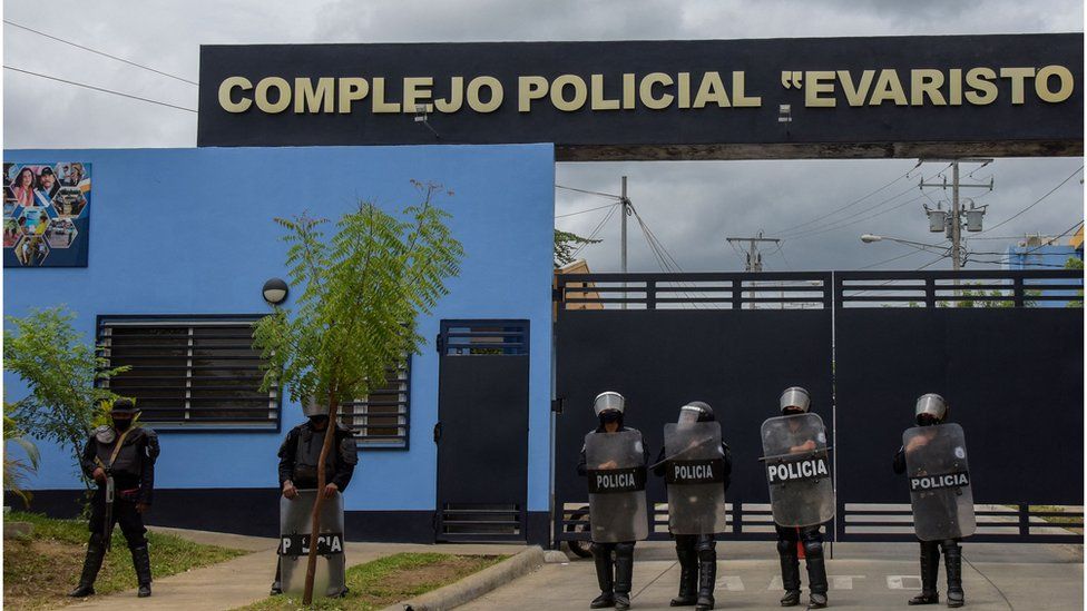 Riot police stand guard outside the Evaristo Vasquez Police Complex, known as "El Chipote", where Nicaraguan pre-presidential candidate Juan Sebastian Chamorro remains detained, in Managua on June 30, 2021.
