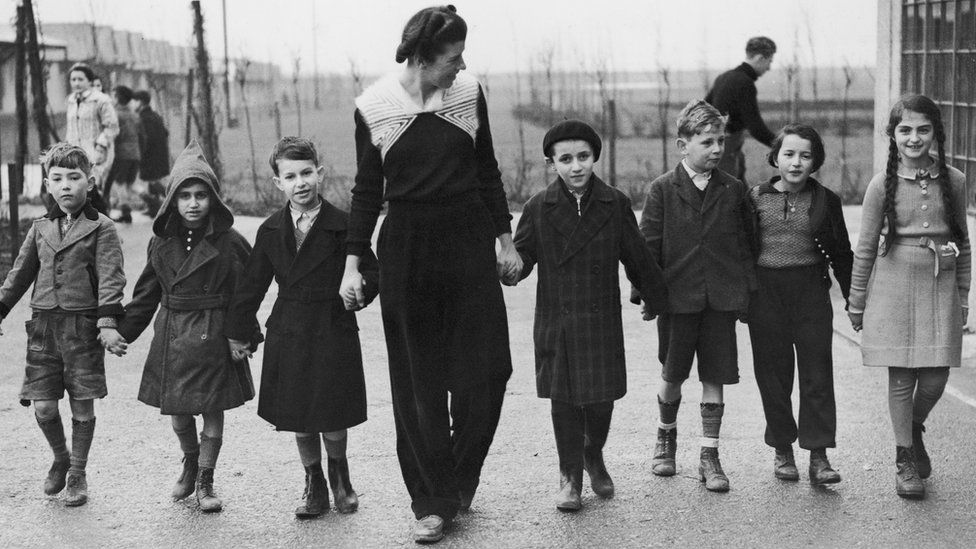 Miss W. Herford takes a group of Jewish refugee children for a walk at Dovercourt camp near Harwich