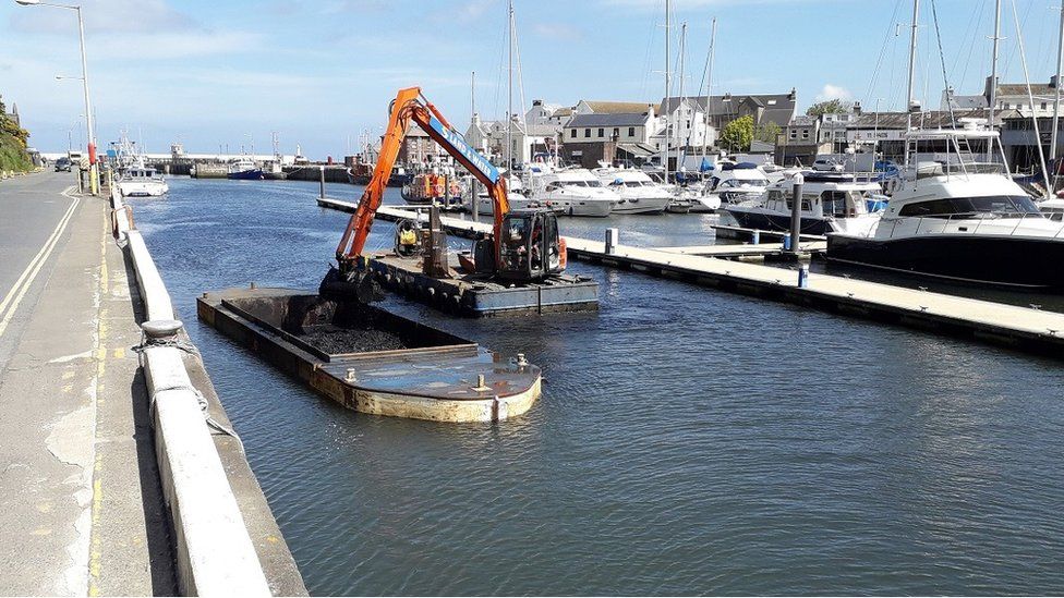 Silt removal in Peel Harbour, Isle of Man