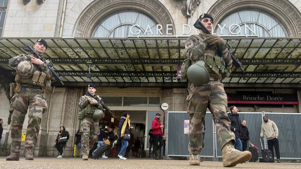 French soldiers secure the area after a man with a knife wounded several people at the Gare de Lyon rail station in Paris