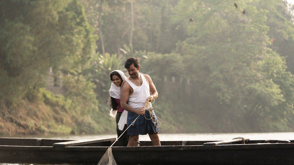 A still from the film showing Najeeb and his wife on a boat