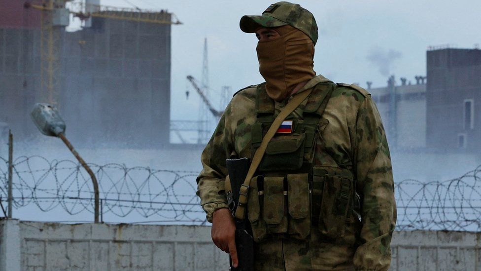 A Russia soldier outside the Zaporizhzhia Nuclear Power Plant