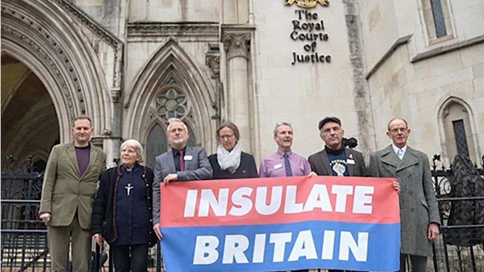 The seven Insulate Britain activists outside the court before their hearing on Tuesday