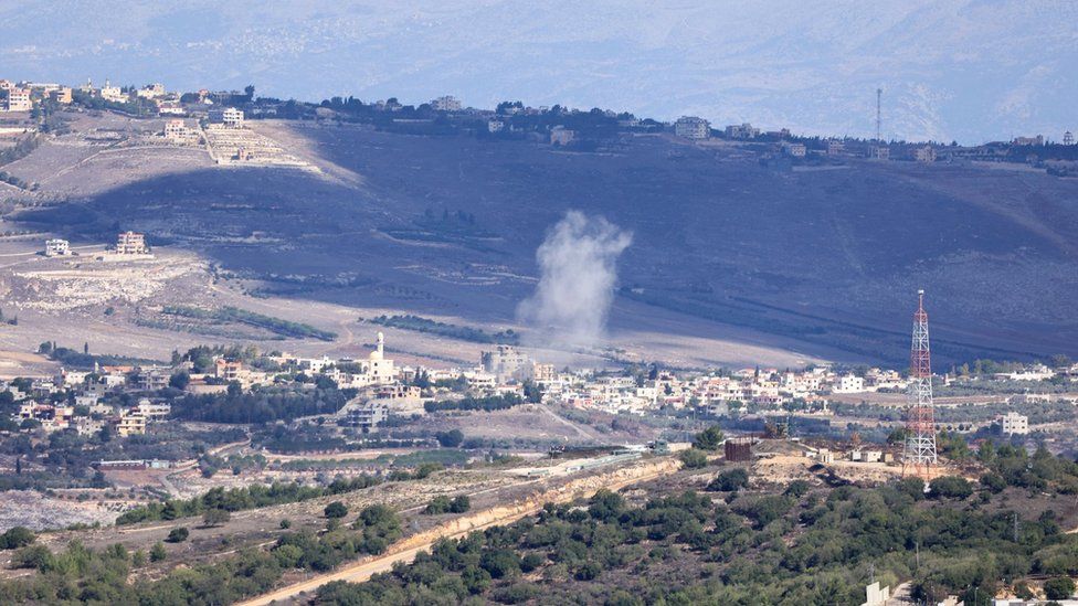 Smoke rises after an artillery strike near the Lebanon border village of Yaroun on 21 November 2023, as seen from northern Israel