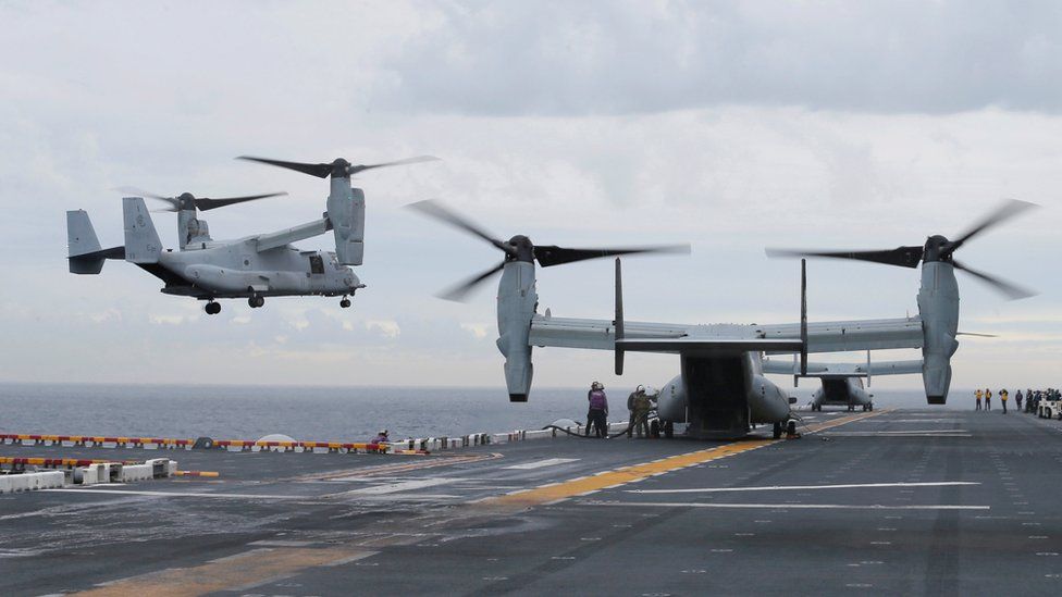 U.S. Marine MV-22B Osprey aircraft land on the deck of the USS Bonhomme Richard amphibious assault ship off Sydney