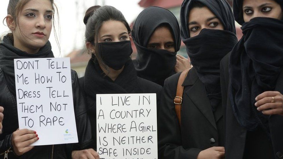 Kashmiri law students hold placards during a protest calling for justice following the rape and murder of an eight-year-old girl in the Indian state of Jammu and Kashmir, in Srinagar on April 18, 2018