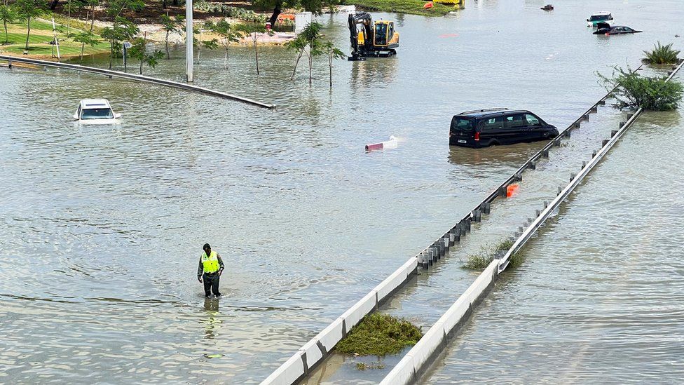 Cars are stuck on a flooded road after a rainstorm hit Dubai