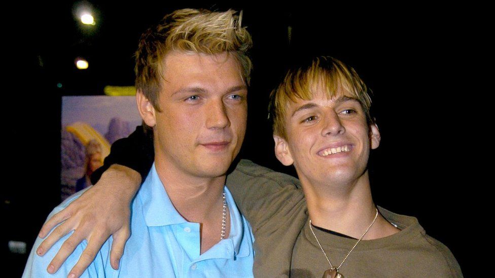 Nick Carter is pictured in an embrace with his younger brother Aaron at an event in 2004