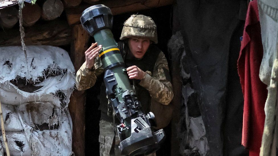 A Ukrainian service member holding a next generation light anti-tank weapon (NLAW) near the front line