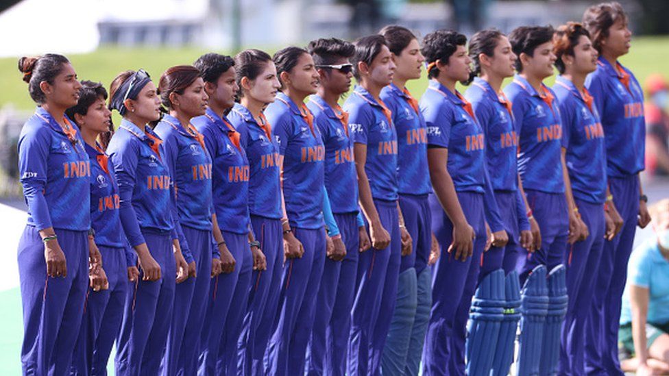 Mithali Raj from India , left, leads her team in the national anthem during the 2022 ICC Women's Cricket World Cup match between India and South Africa at Hagley Oval on March 27, 2022