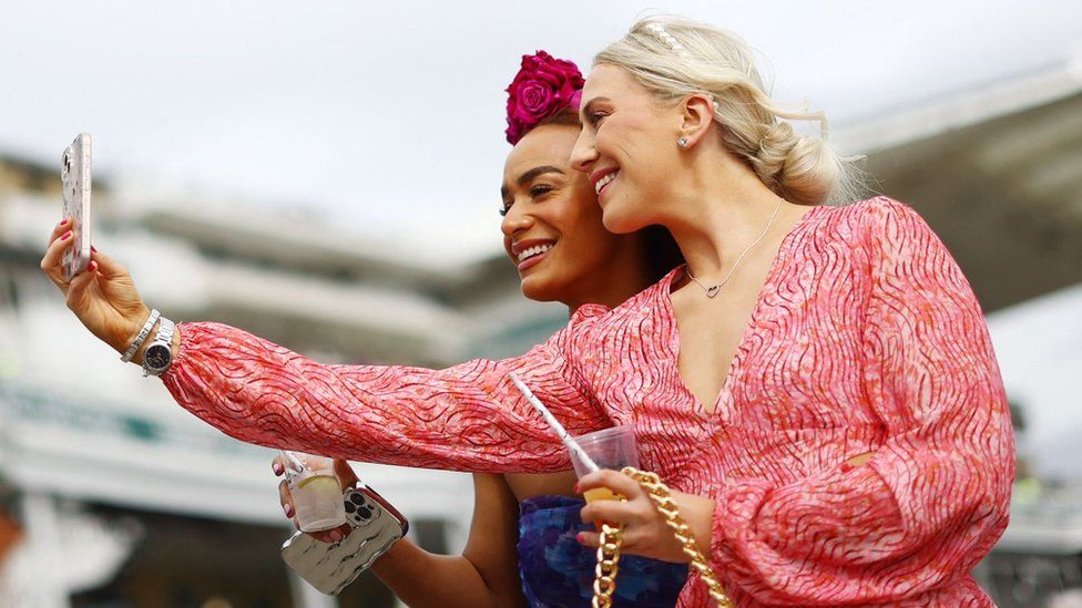 Two women take a selfie at Aintree Ladies Day 2024