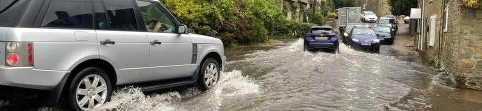 Cars on flooded road in Dorset